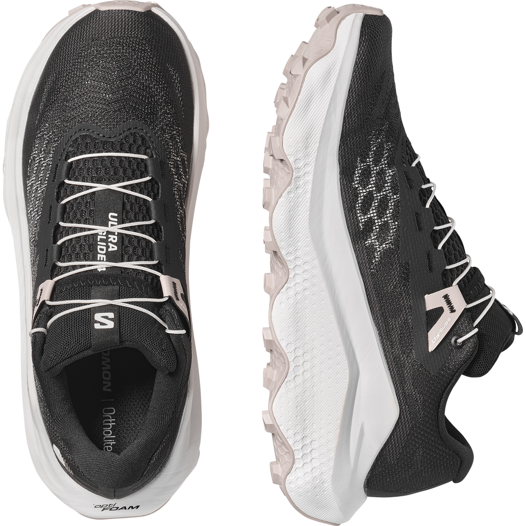 Black and white running shoes with visible brand logo on a white background