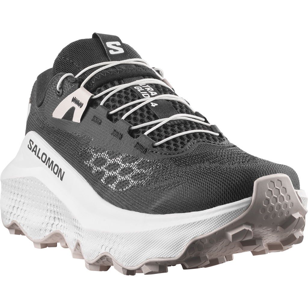 Black and white Salomon running shoe on a white background