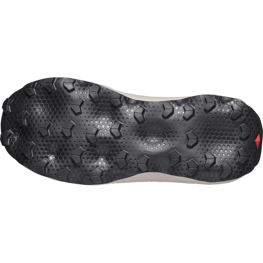 Close-up of a shoe sole with a textured pattern on a white background