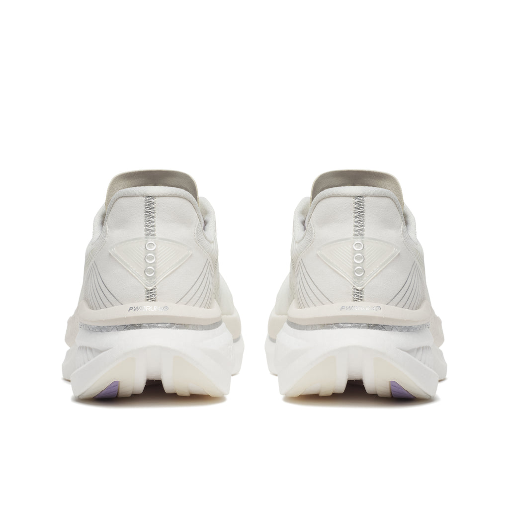 White athletic shoes with visible brand logo on a white background