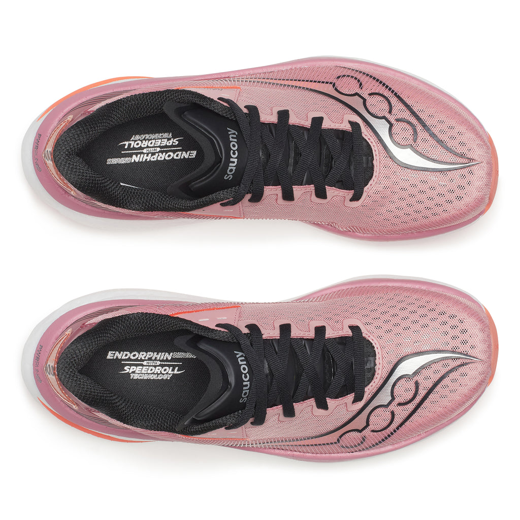 Pink running shoes with black soles on a white background