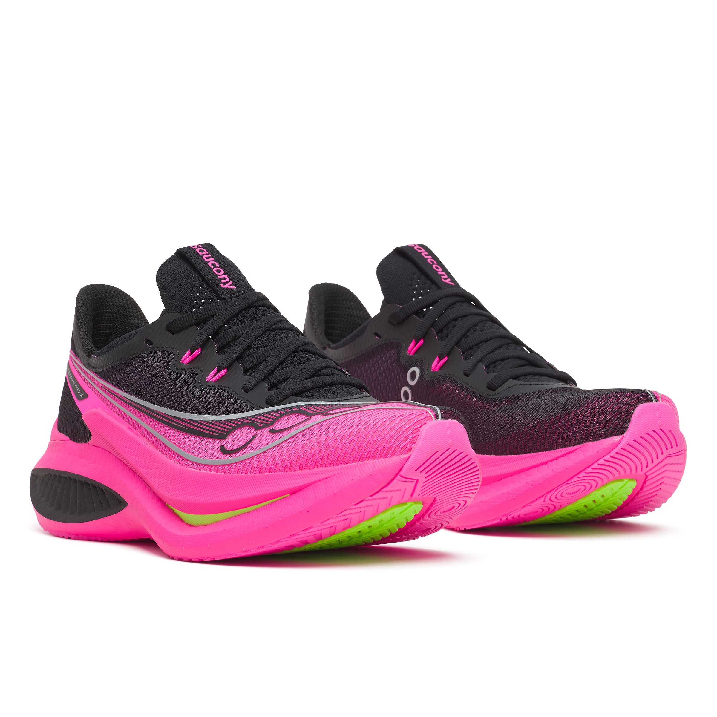 Black and pink athletic shoes with green accents on a white background