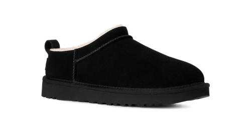 Black UGG slip-on shoe on a white background