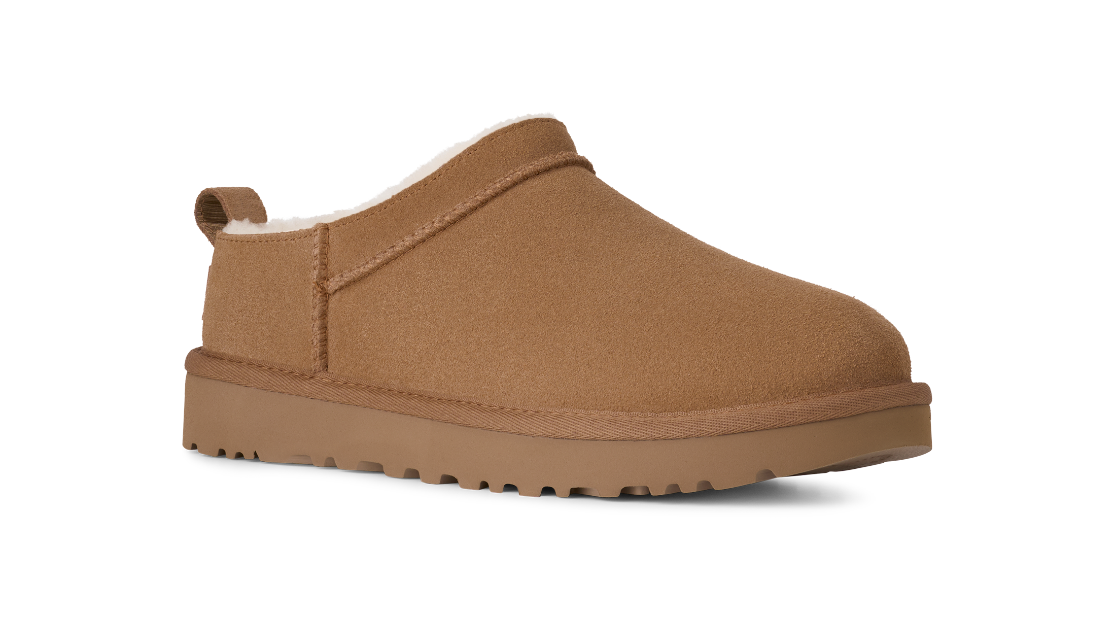 Brown slip-on shoe with white interior on a white background