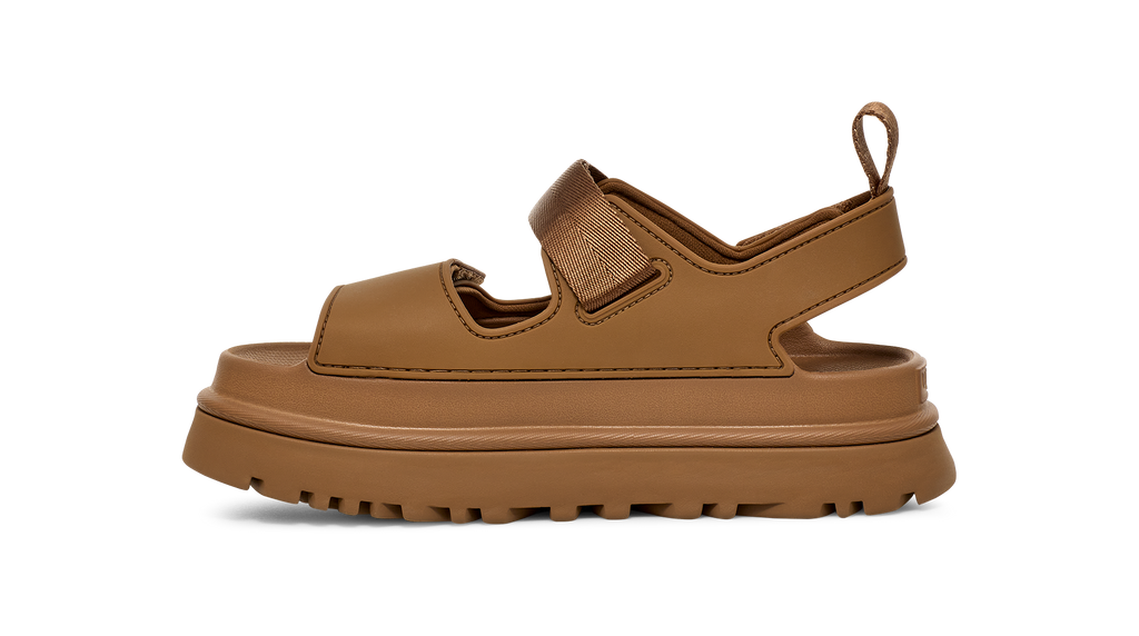 Brown Ugg sandal with thick sole on a white background