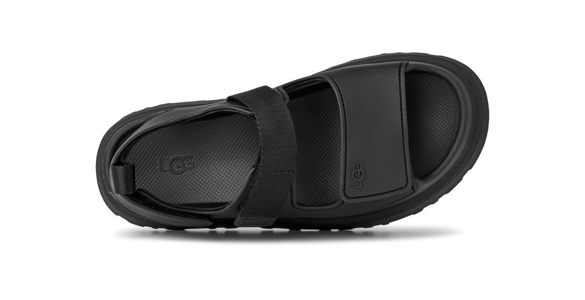 Black sandal UGG with a strap on a white background