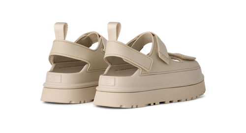 Beige platform UGG sandals on a white background