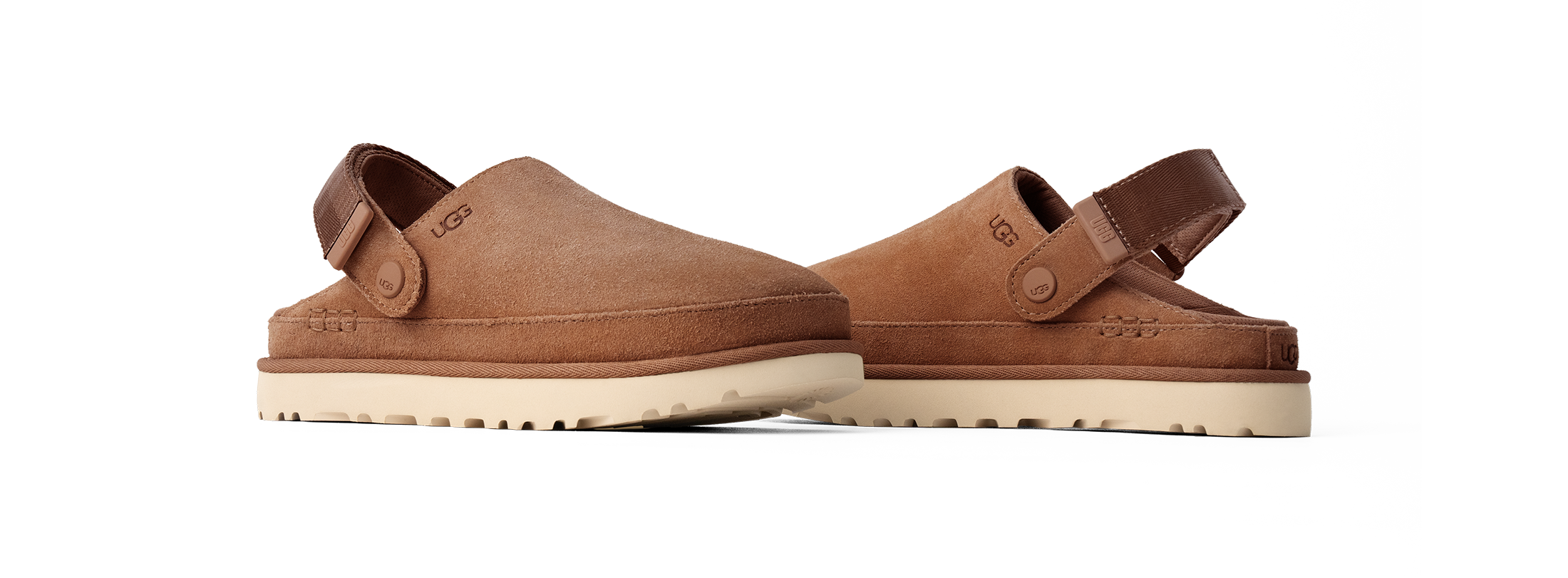 Pair of brown UGG CLOG sandals on a white background