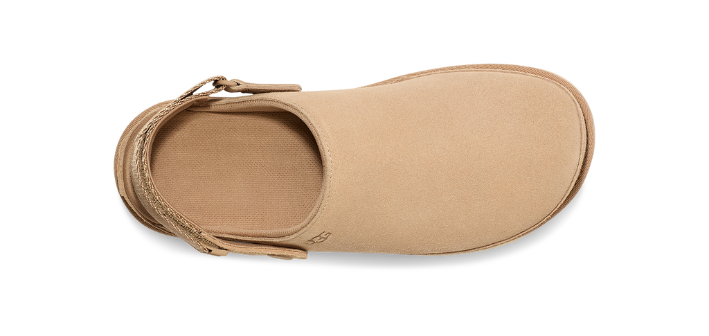 Tan UGG sandal on a white background