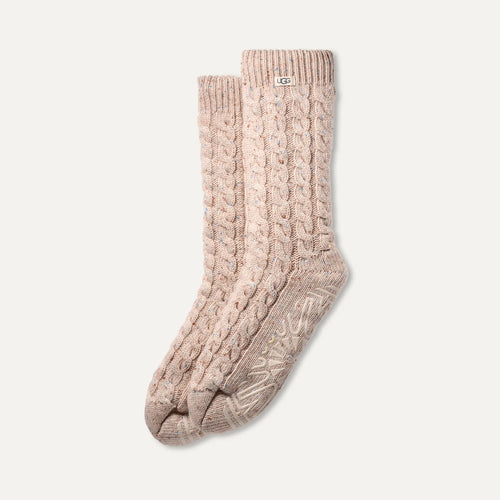 Pair of ugg cable knit socks on a light gray background