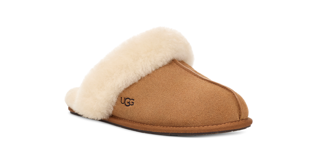 Brown UGG slipper with beige fur lining on a white background