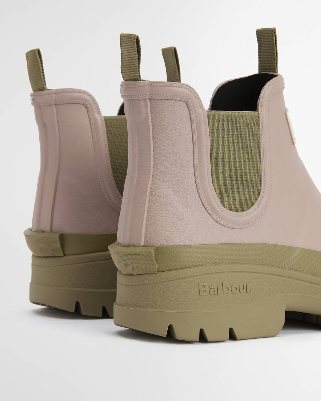 Pair of beige and brown boots with 'Barbour' branding on a white background