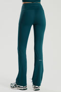 Teal pants  by red run worn by a person on a white background