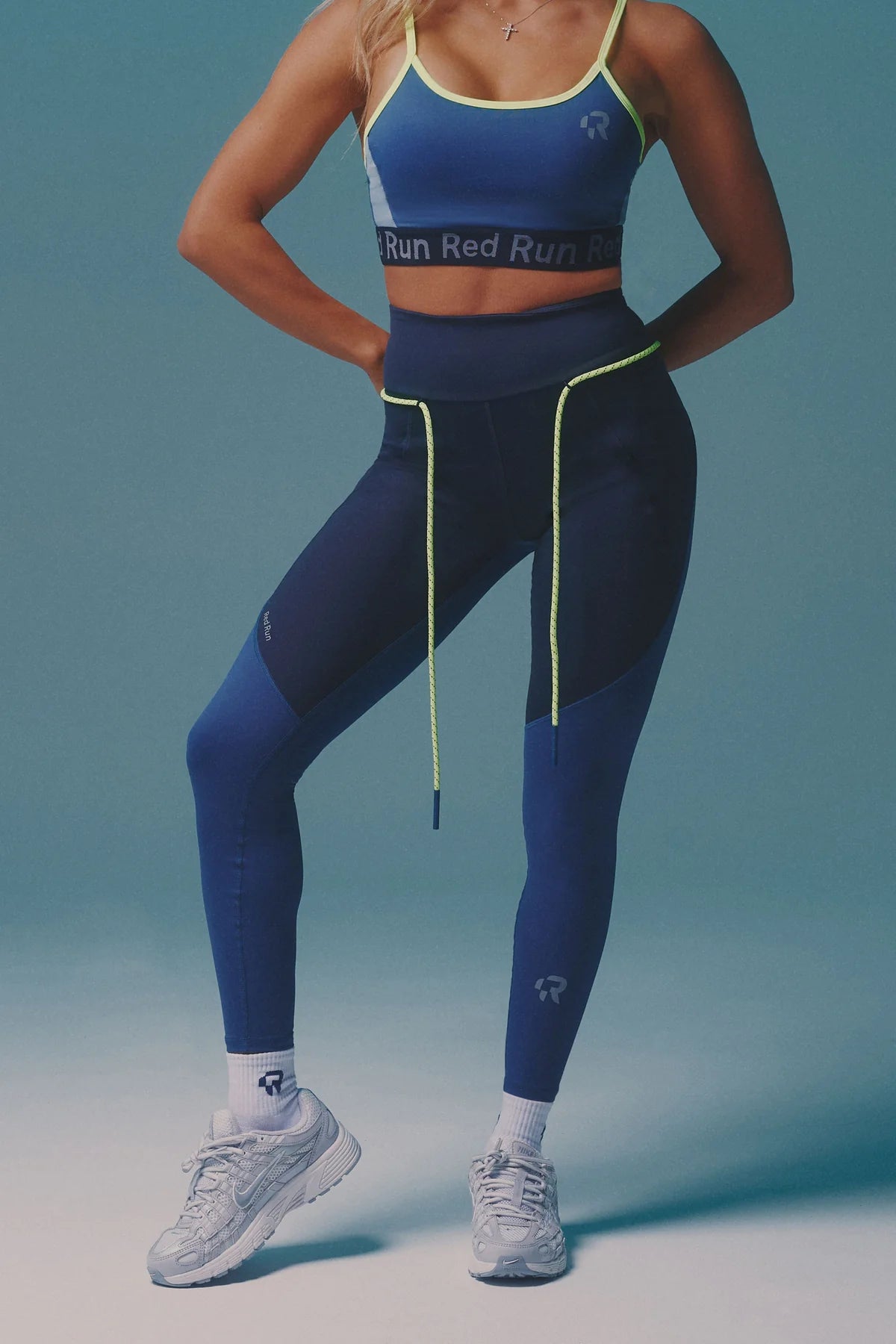 Person wearing a blue athletic outfit with 'Run Red Run' text on a gradient background