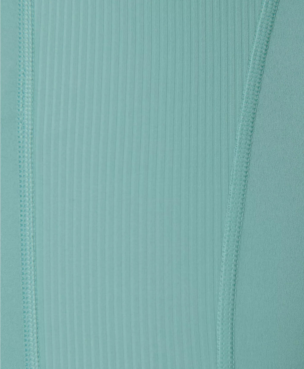 Close-up of ribbed fabric with a teal color