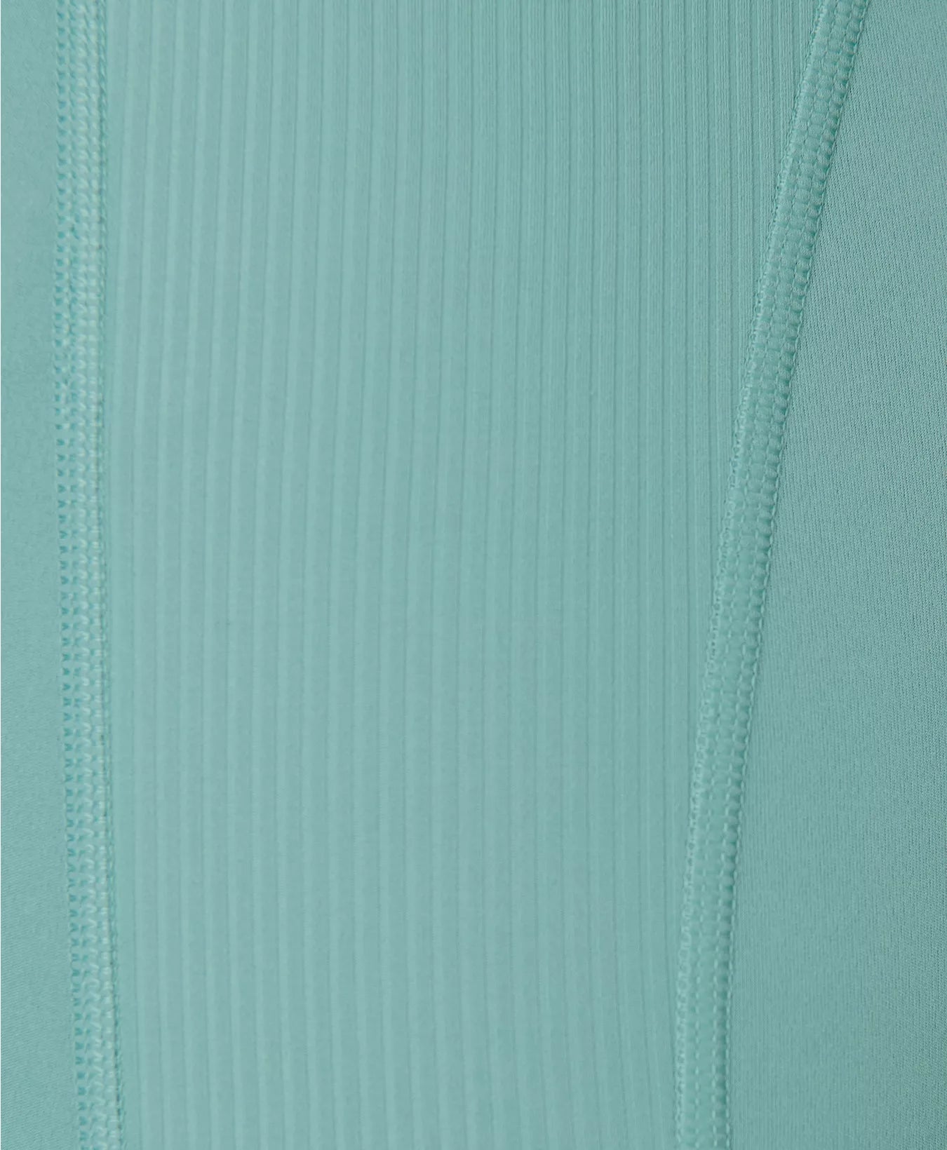 Close-up of ribbed fabric with a teal color