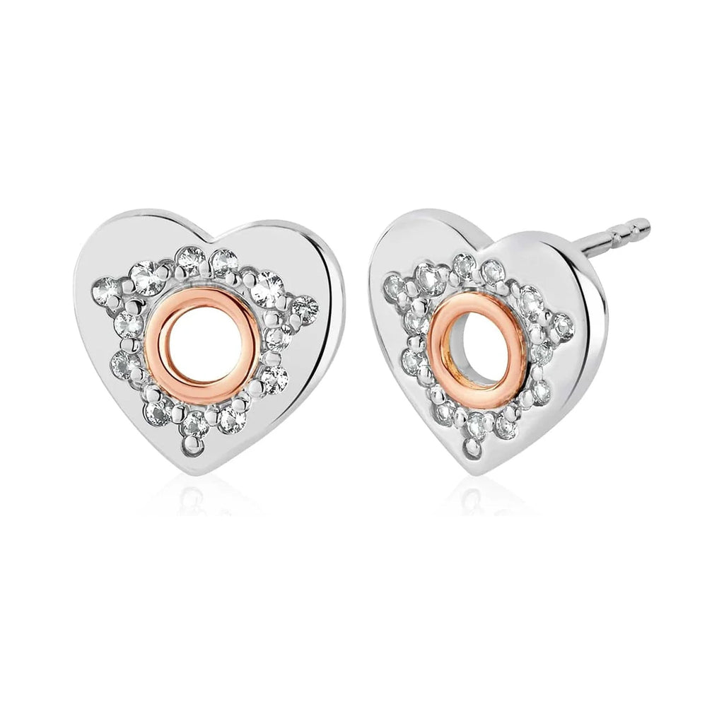 Sterling silver heart stud earrings with white topaz and rose gold details, showcasing Clogau's Cariad design.