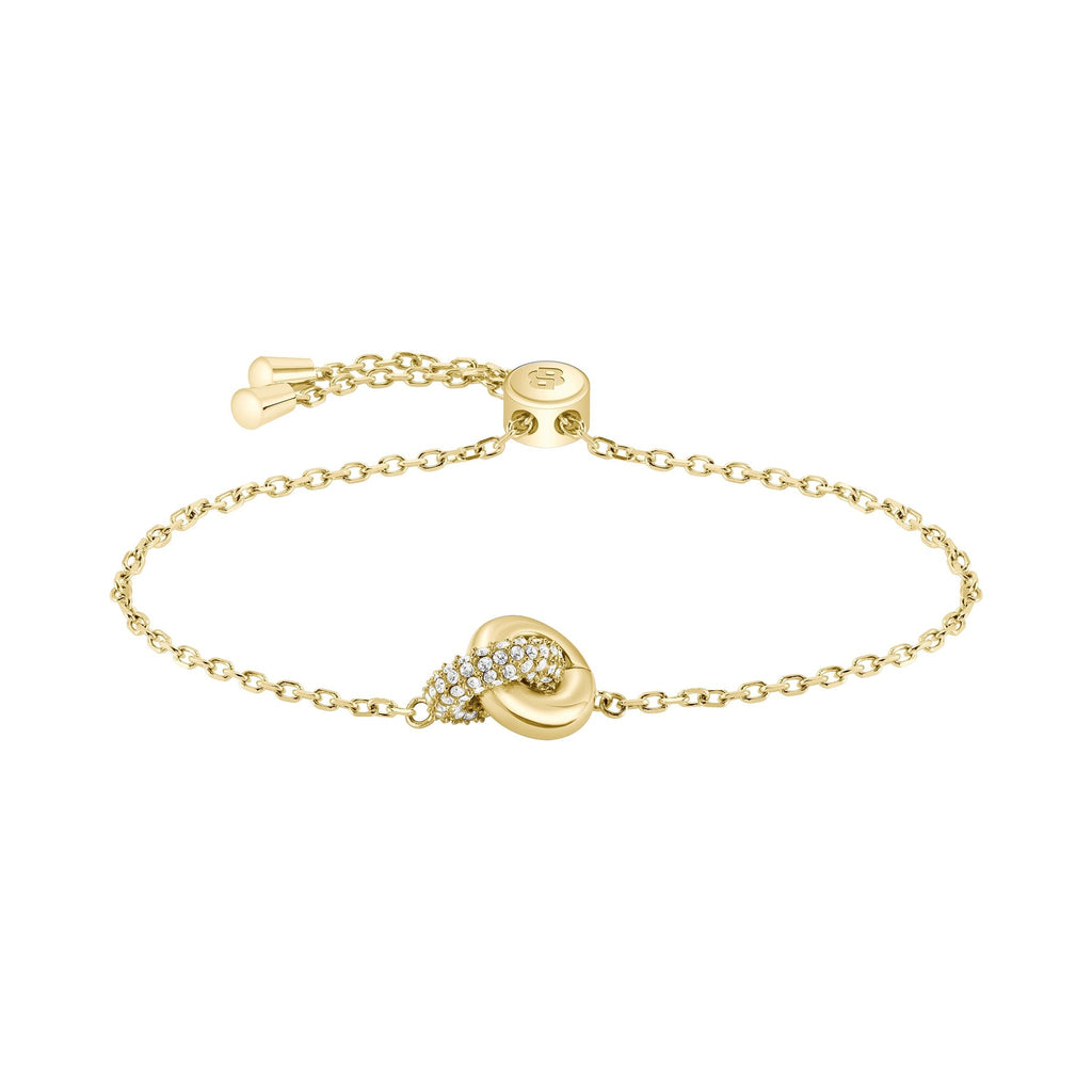 Gold chain bracelet with diamond-studded knot.
