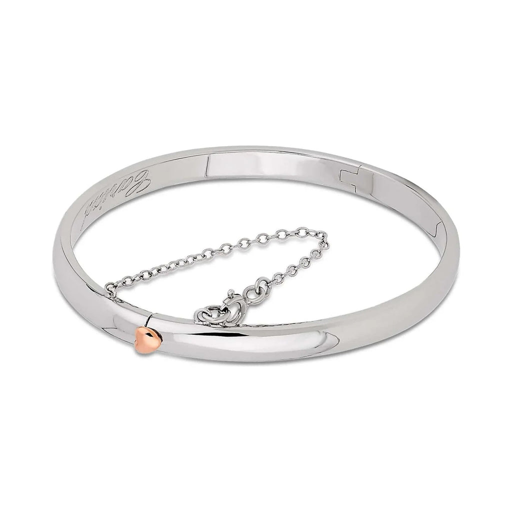 Silver bracelet with rose gold heart.