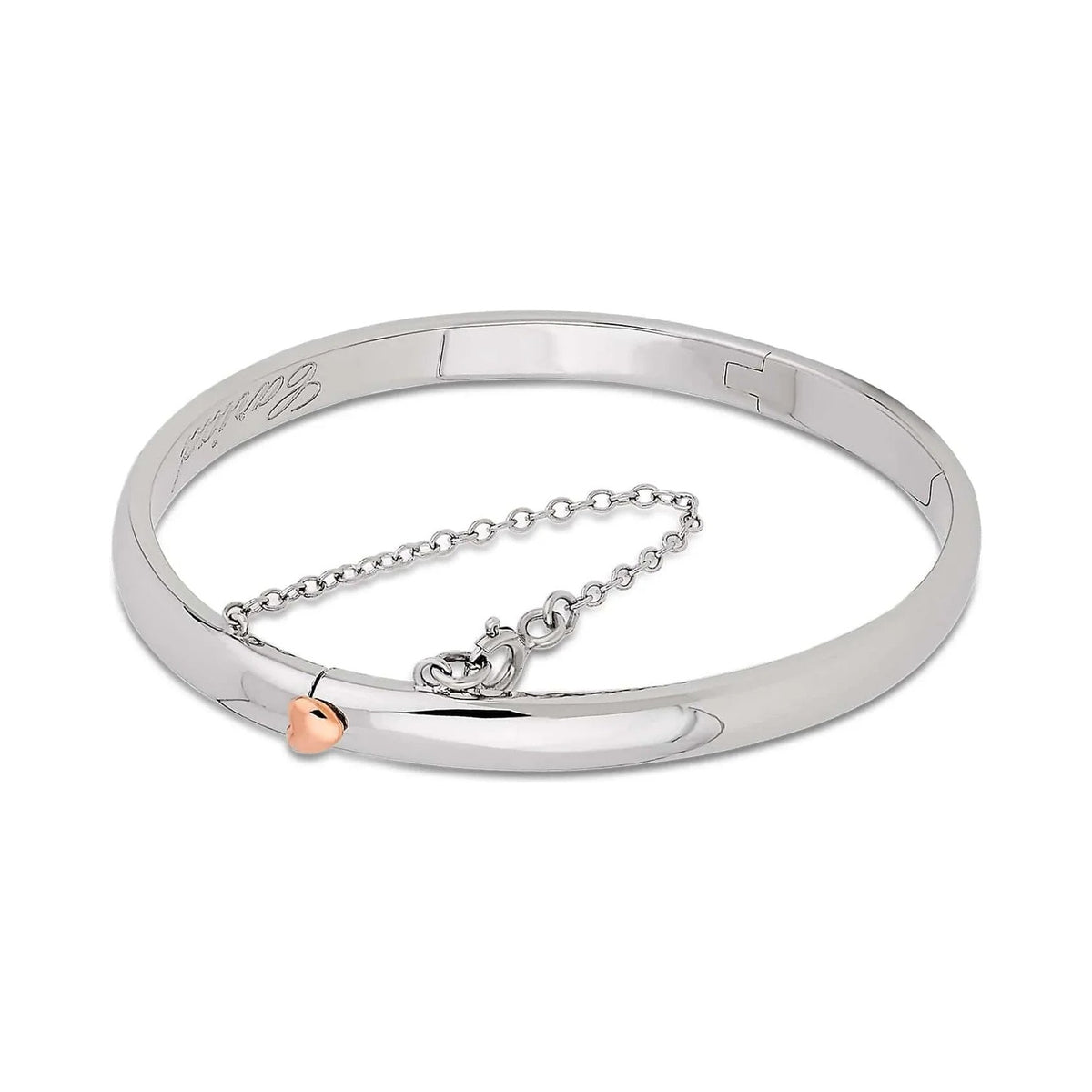 Silver bracelet with rose gold heart.