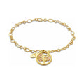 Gold chain link bracelet with gold tree charm.