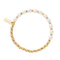 A pearl and gold beaded bracelet.
