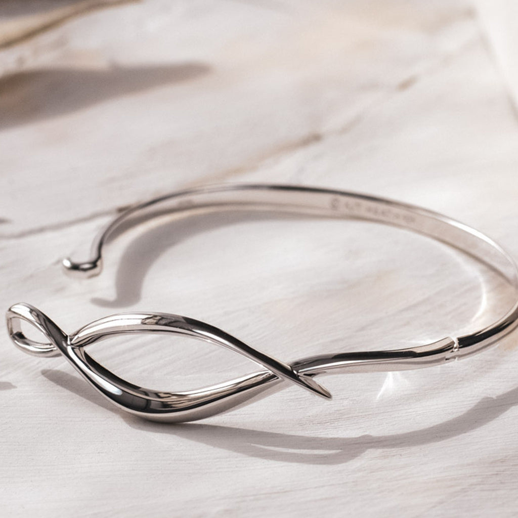 The Kit Heath Entwine Twine Twist Hinged Bangle, a silver bracelet from Kit Heath, available at OD’s Jewellers in St Helens.