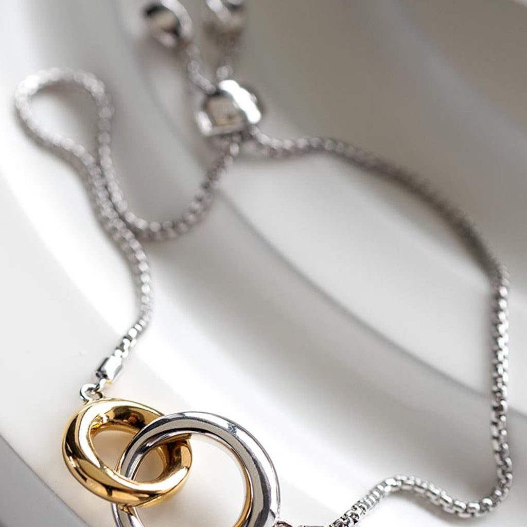 Kit Heath Bevel Cirque Link Golden Toggle Bracelet, a two-tone silver-gold plated bracelet from Kit Heath, at OD’s Jewellers in St Helens
