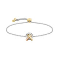 A two-tone silver and gold chain bracelet with a loop and knot center.