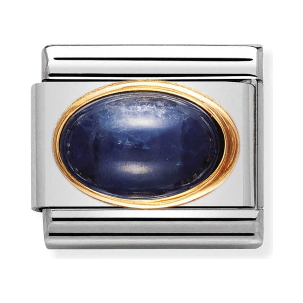 Silver charm with a blue stone and gold trim.