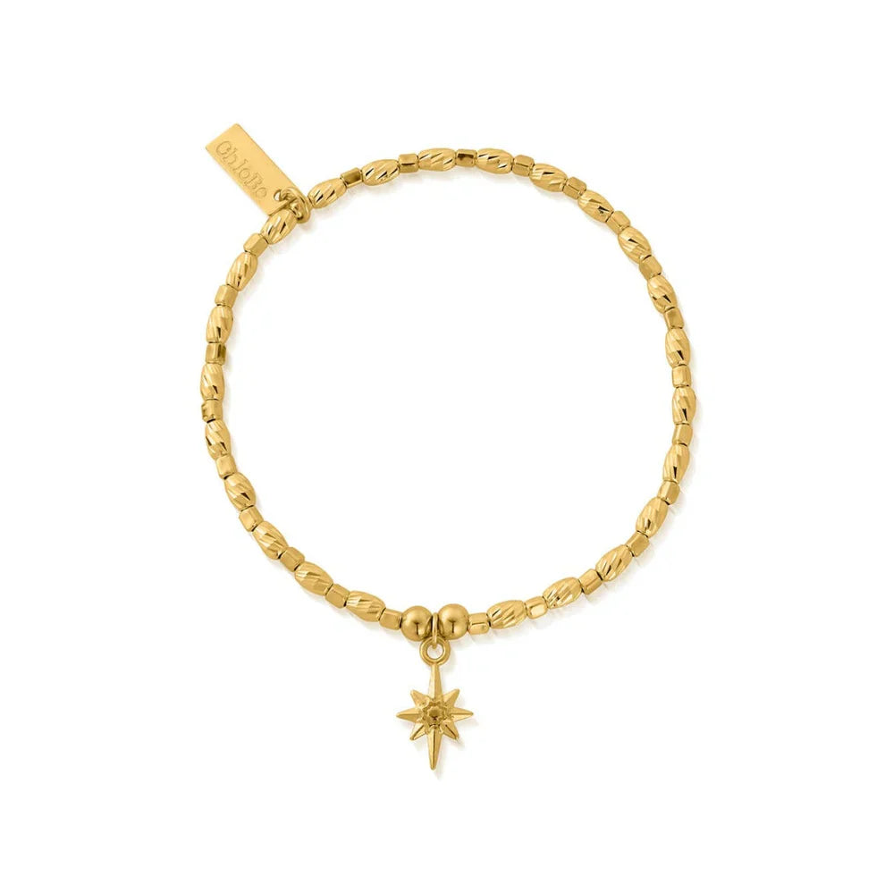 Gold beaded bracelet with star charm.
