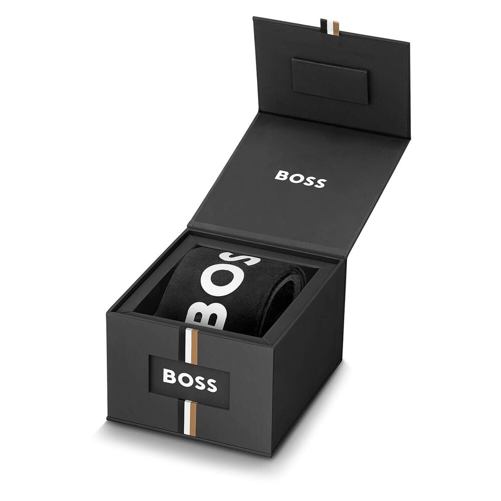 Open black BOSS box with rolled BOSS-branded socks inside.
