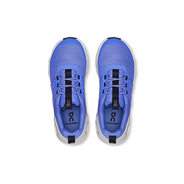 Pair of blue athletic shoes on a white background