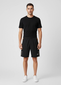 Mens BOSS Green Black S_T-Match 9 inch Shorts on model