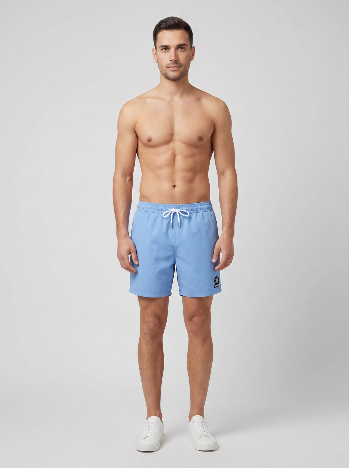Men's Sandbanks Dusty Blue Badge Logo Recycled Swim Short — on model