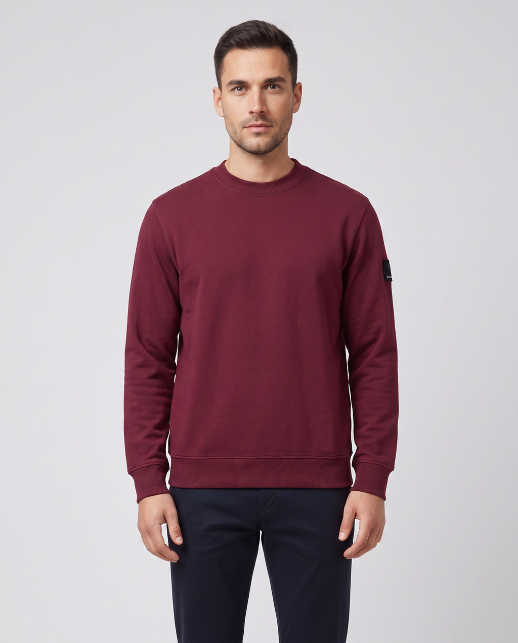 Men's Sandbanks Badge Logo Sweatshirt in Port — on model