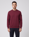 Men's Sandbanks Badge Logo Sweatshirt in Port — on model