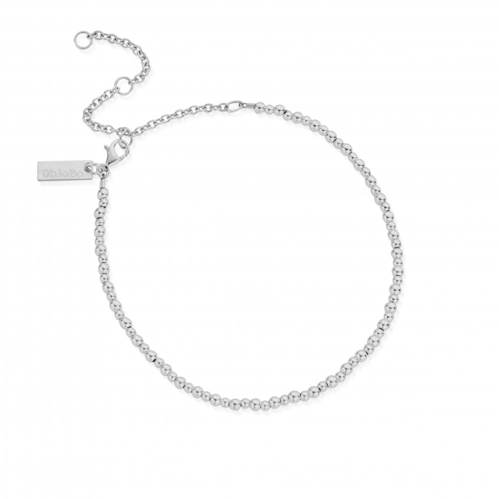 Close-up of a ChloBo Mini Cute beaded anklet with an adjustable chain, showcasing the delicate silver design.