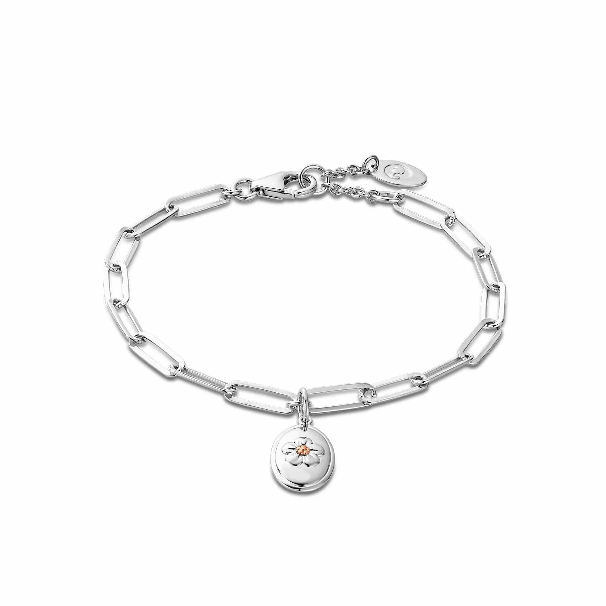 Silver chain bracelet with a flower charm.