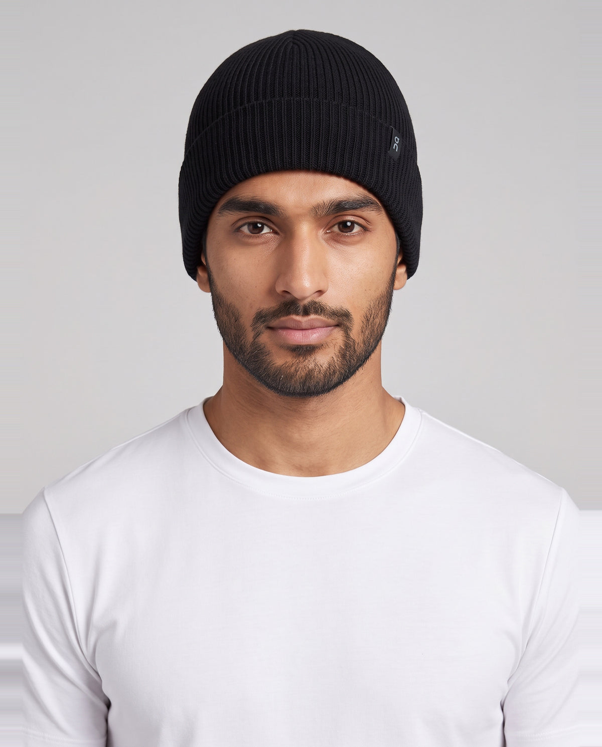 Unisex On Running Merino Beanie in Black — on model