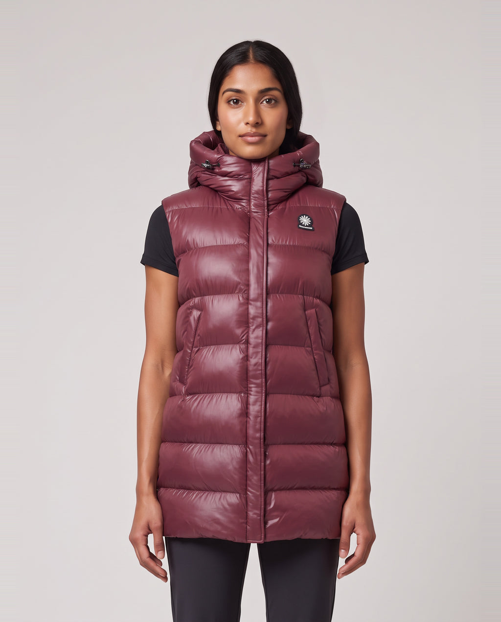 Women's Sandbanks Shell Bay Hooded Long Gilet in Port — on model