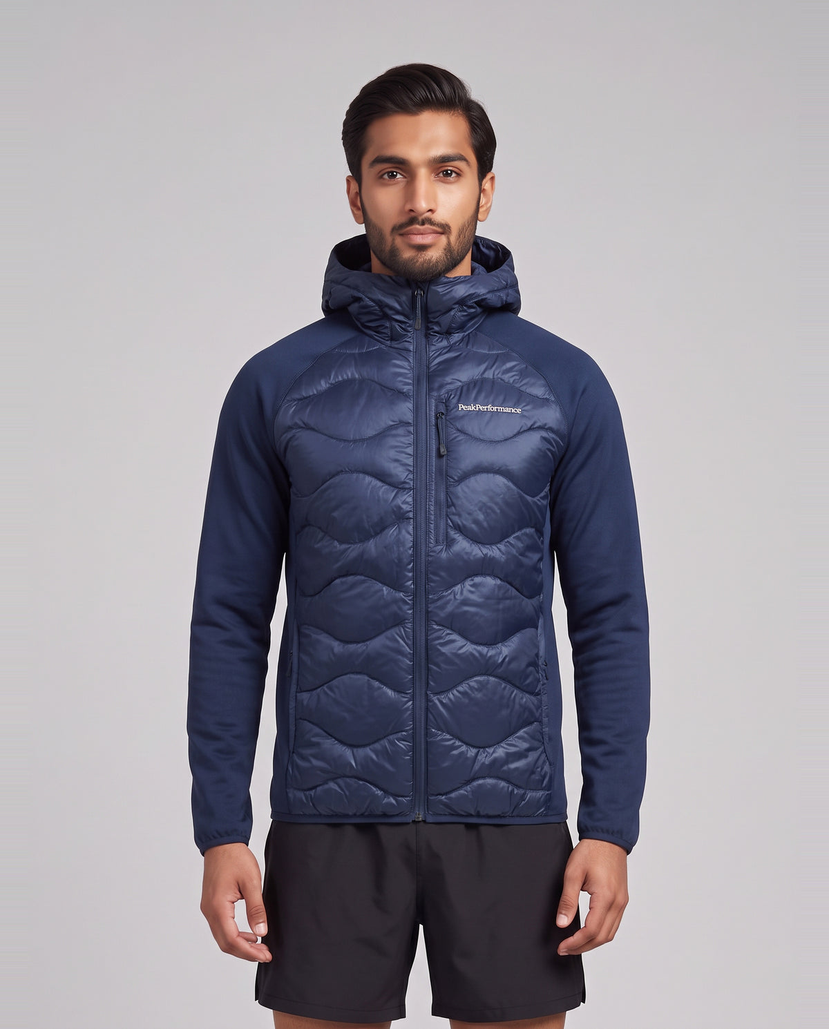 Men's Peak Performance Helium Down Hybrid Hood in Blue Shadow — on model