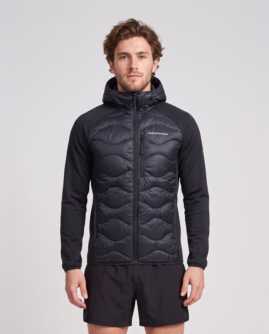 Men's Peak Performance Helium Down Hybrid Hood in Black — on model