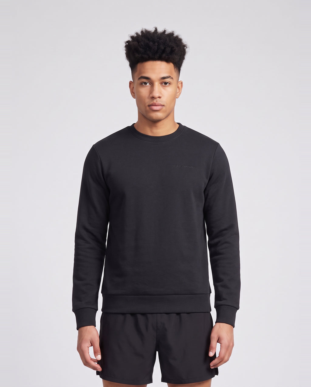 Men's Peak Performance Original Small Logo Crew in Black — on model
