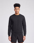 Men's Peak Performance Original Small Logo Crew in Black — on model