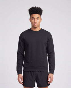 Men's Peak Performance Original Small Logo Crew in Black — on model