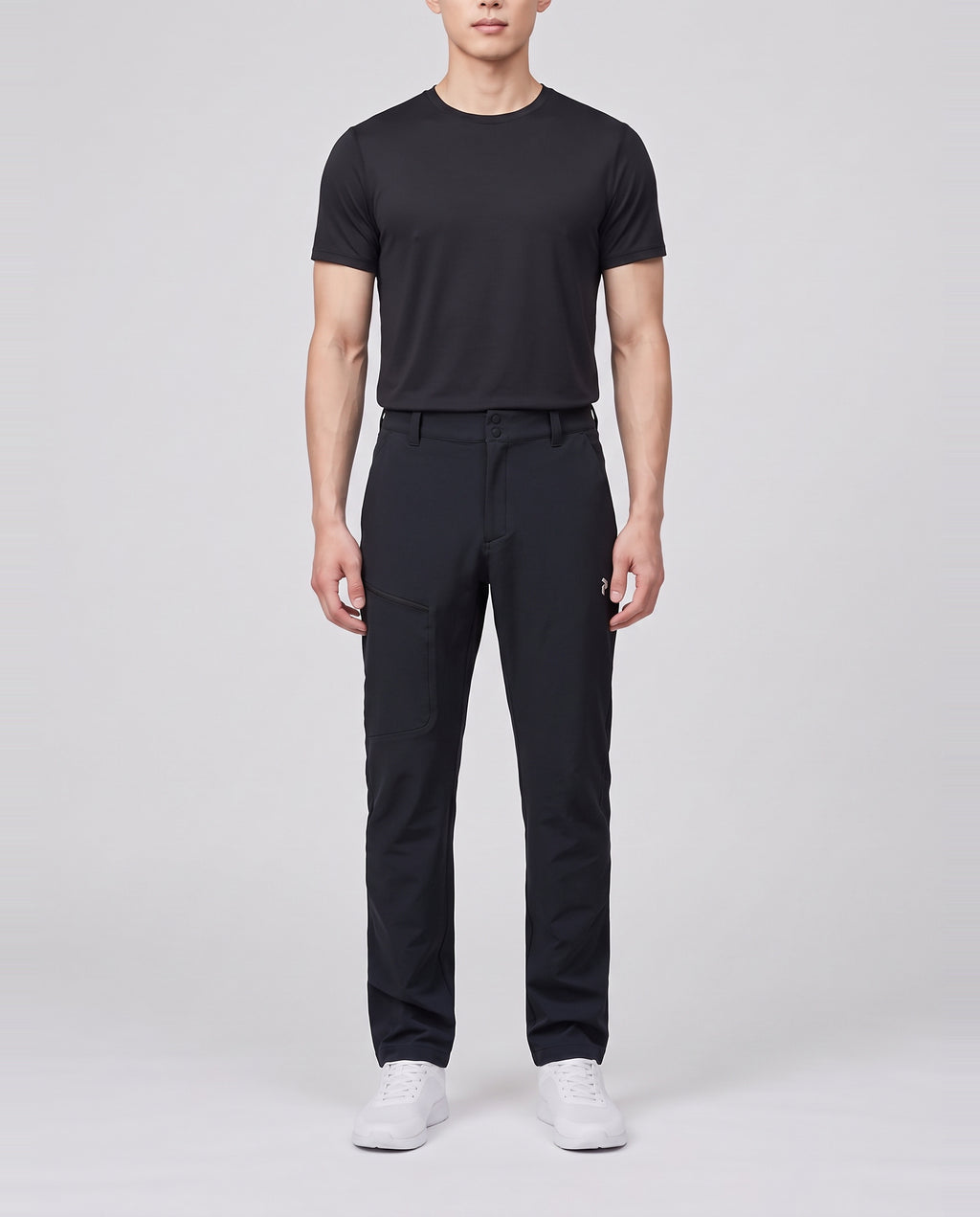 Men's Peak Performance Scale Softshell Pants in Black — on model