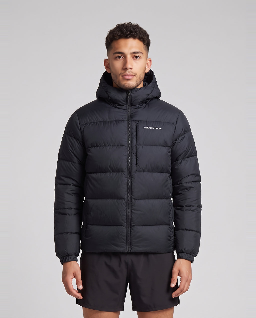 Men's Peak Performance Frost Down Puffer Jacket in Black — on model