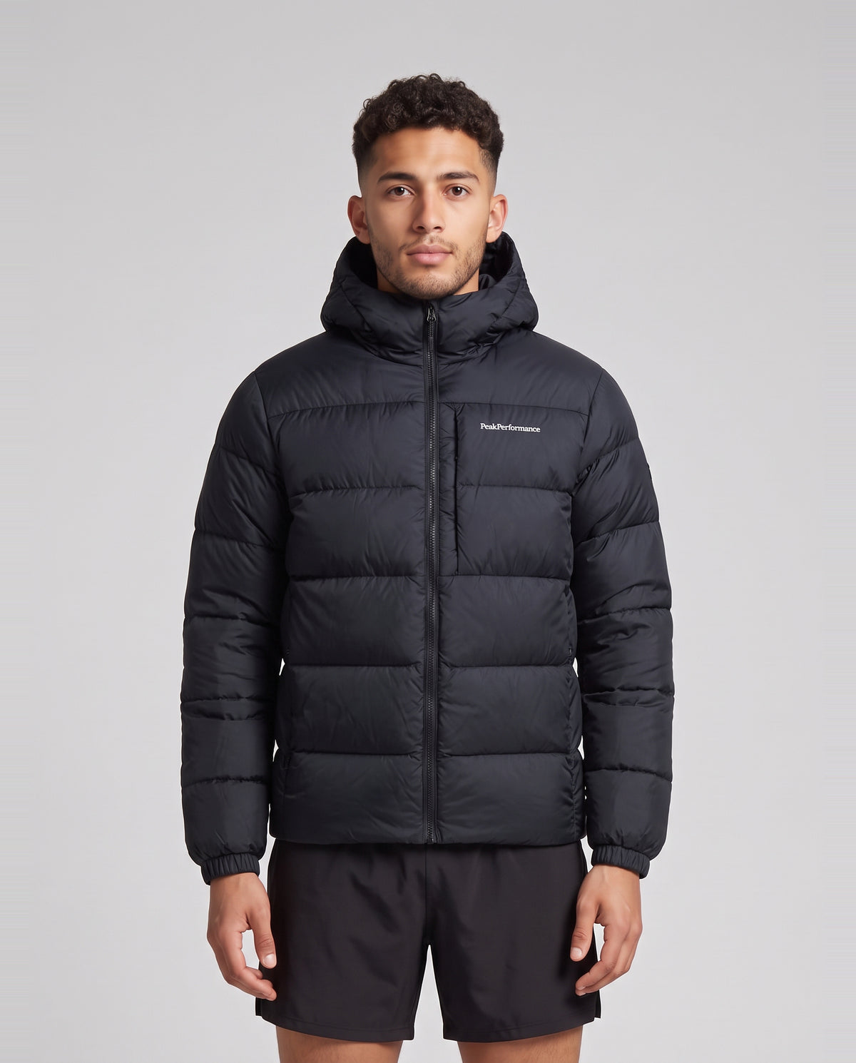 Men's Peak Performance Frost Down Puffer Jacket in Black — on model