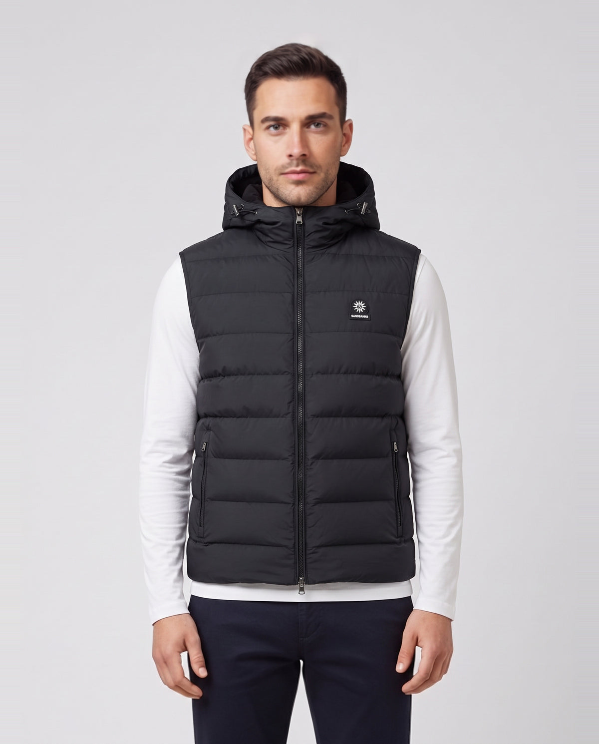 Men's Sandbanks Frontier Micro Puffer Hooded Gilet in Black — on model